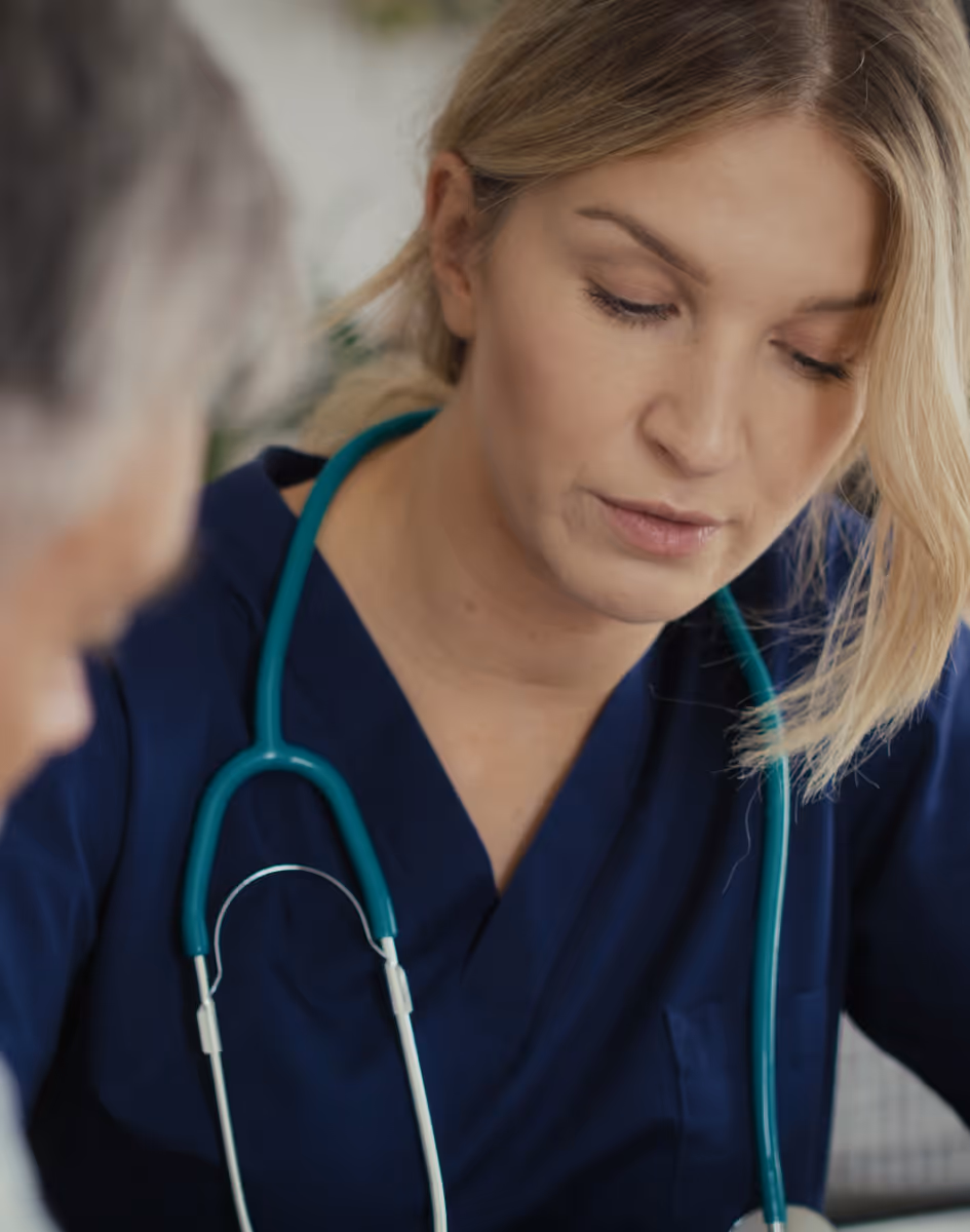 Nurse supporting a patient with a medical device at home